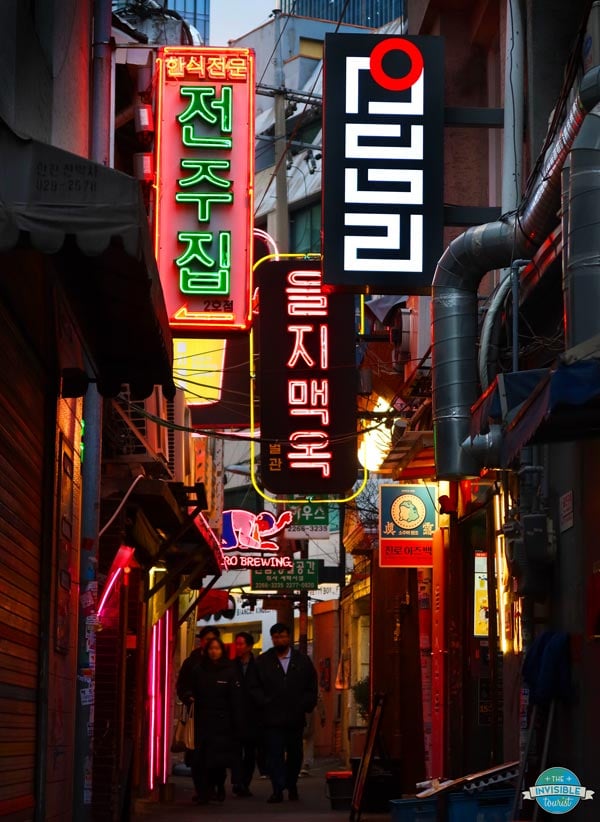Make sure to see the retro neon signs of Euljiro during your 7 days in Seoul